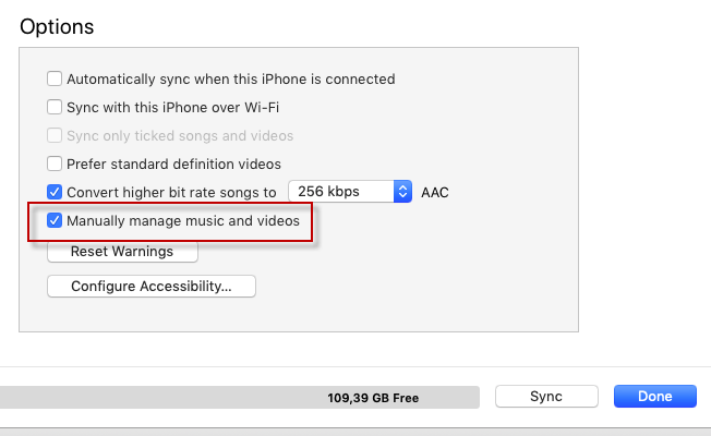 Manually manage music and videos option under iTunes Options