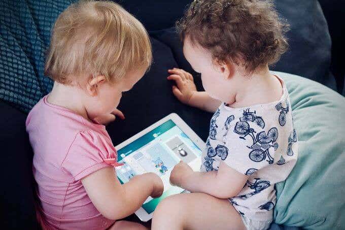 Two toddlers with an iPad