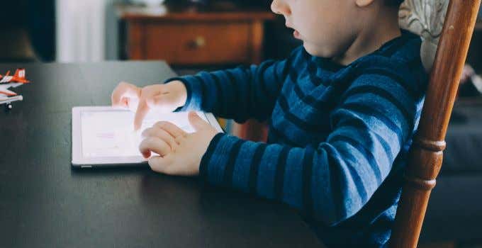 Child playing with an iPad