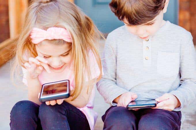 Children playing on iPhones