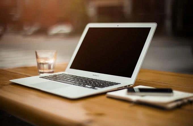 Image of a MacBook on a wooden table 