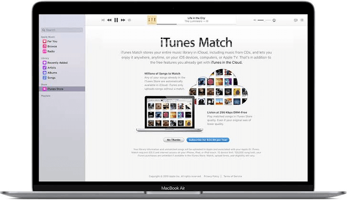 Laptop with iTunes Match window 