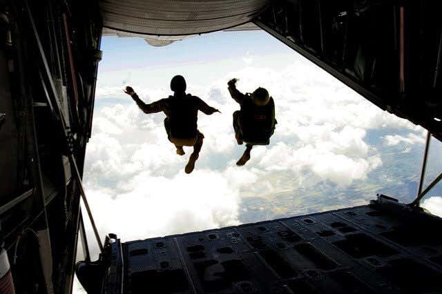 Two people jumping out of a plane 