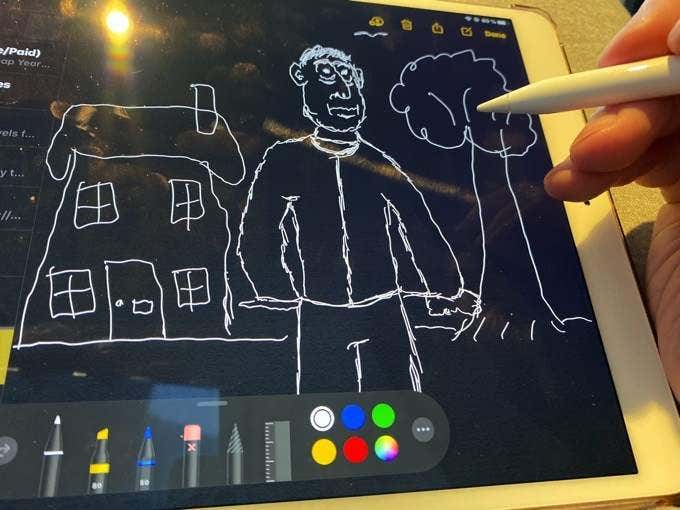 Someone drawing with an Apple Pencil 