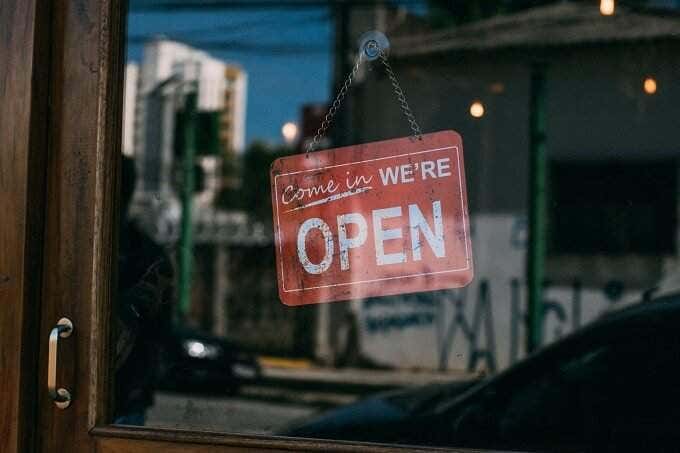 Open sign hanging in a shop door 
