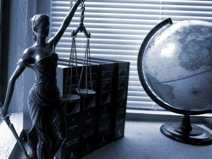 Statue of Blind Justice on a desk 