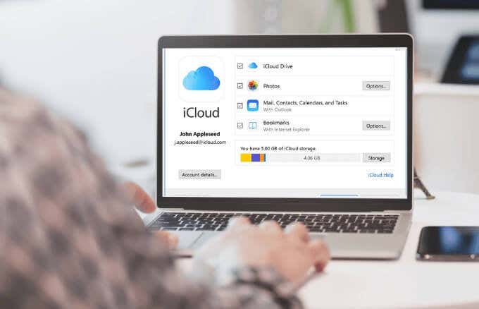 Someone connecting a Mac laptop to iCloud 