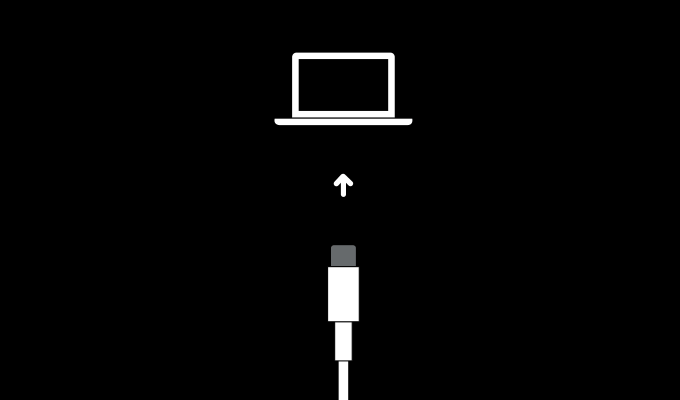 Lightning cable being plugged into laptop