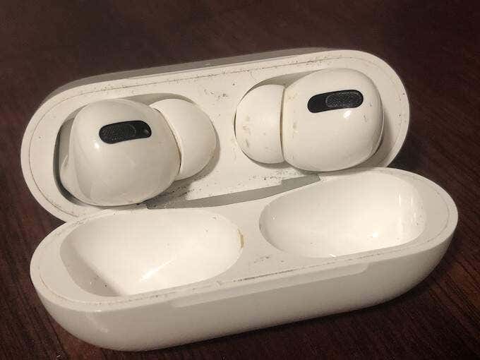 A pair of dirty AirPods