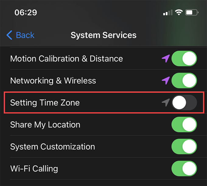 Settings > Privacy > Location Services > System Services > Setting Time Zone turned off