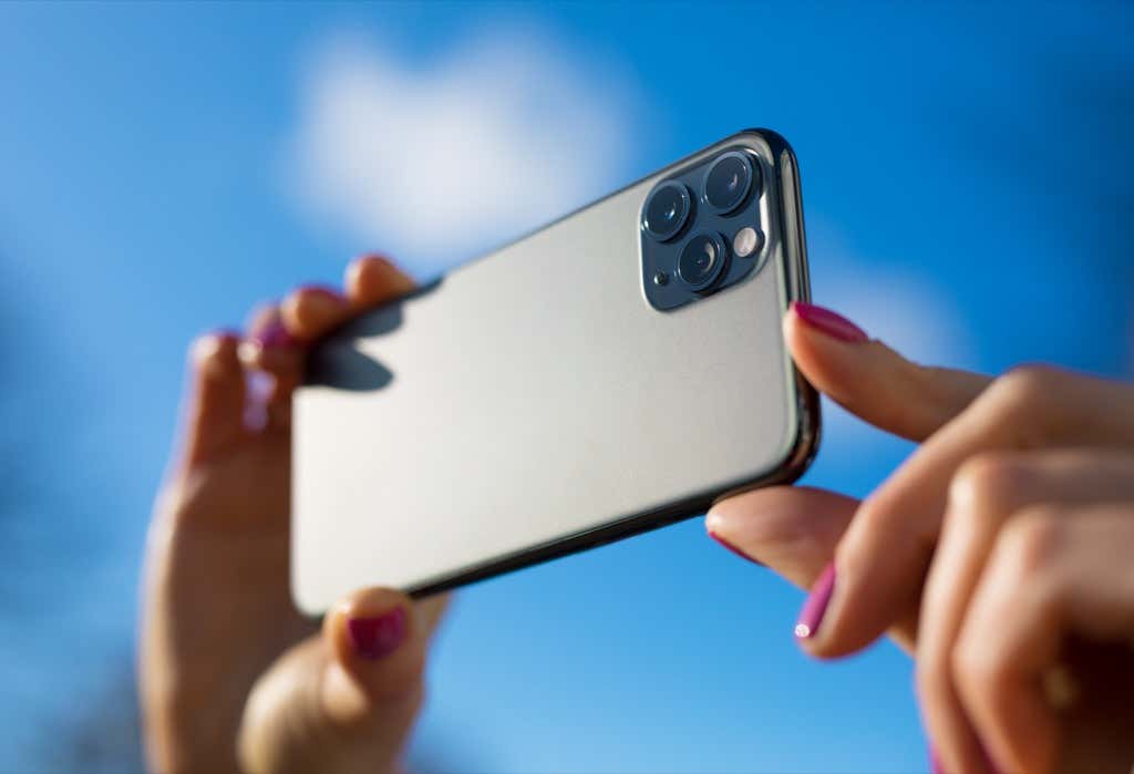 Someone taking a photo with an iPhone