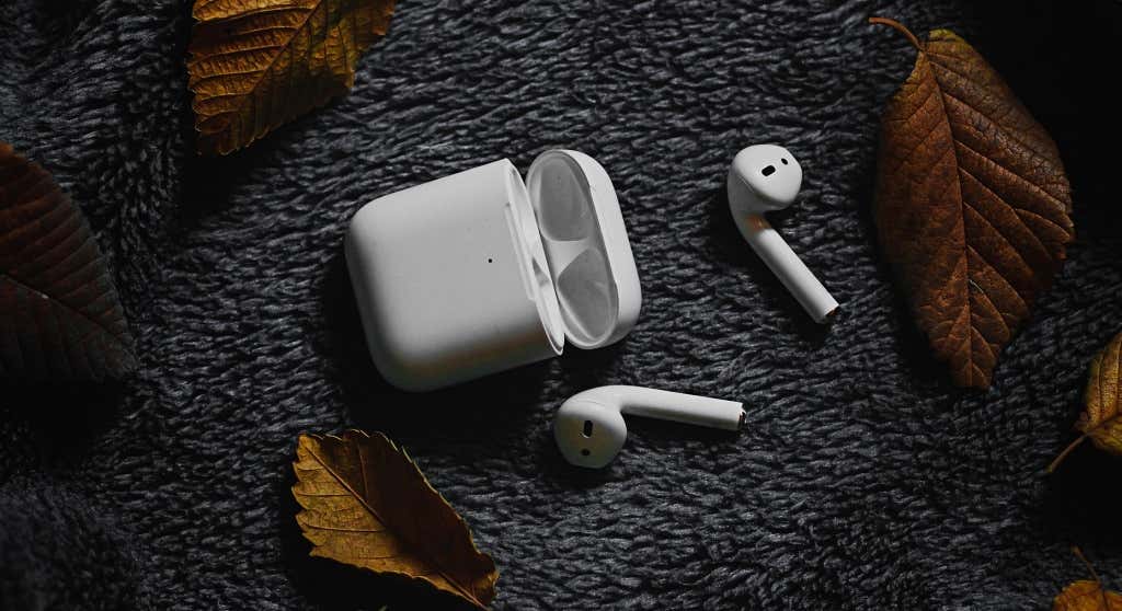 AirPods next to their case