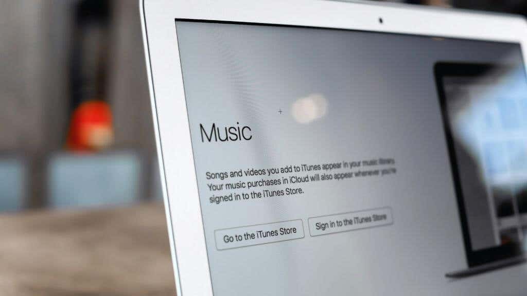 Mac laptop screen with Apple Music