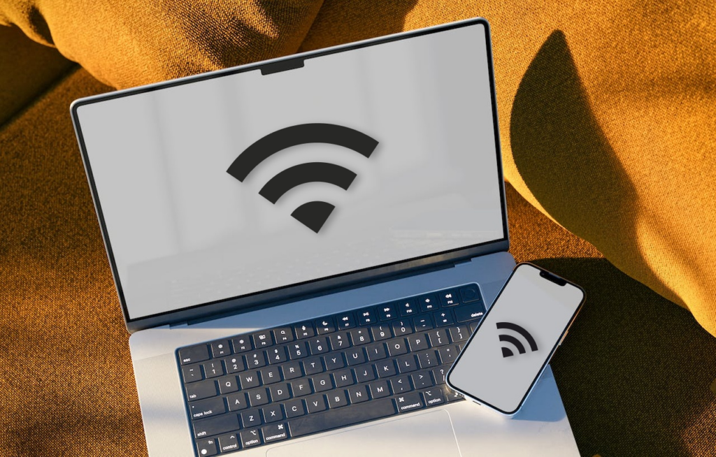 MacBook and iPhone with Wi-Fi icons on their screens