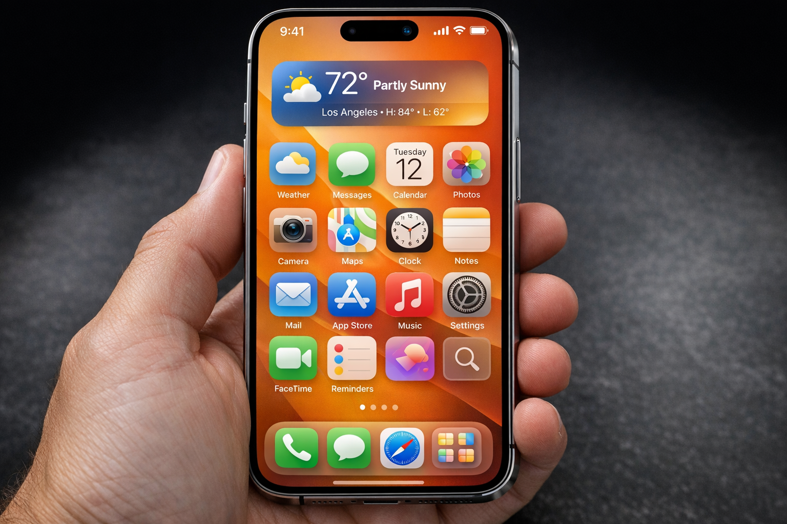 iPhone in hand showing the iOS 26 home screen, modern device
