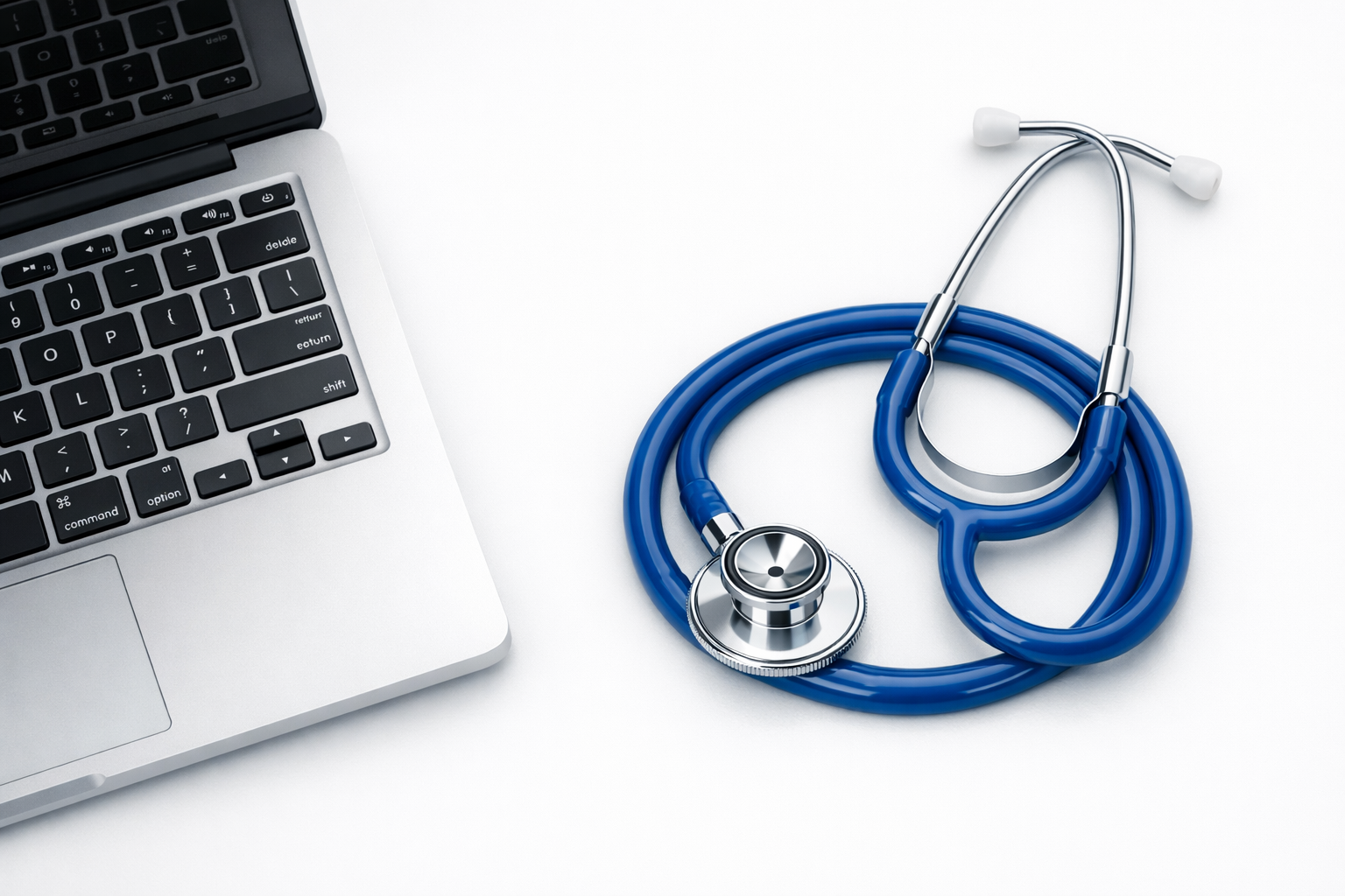 Mac laptop with a stethoscope on the keyboard