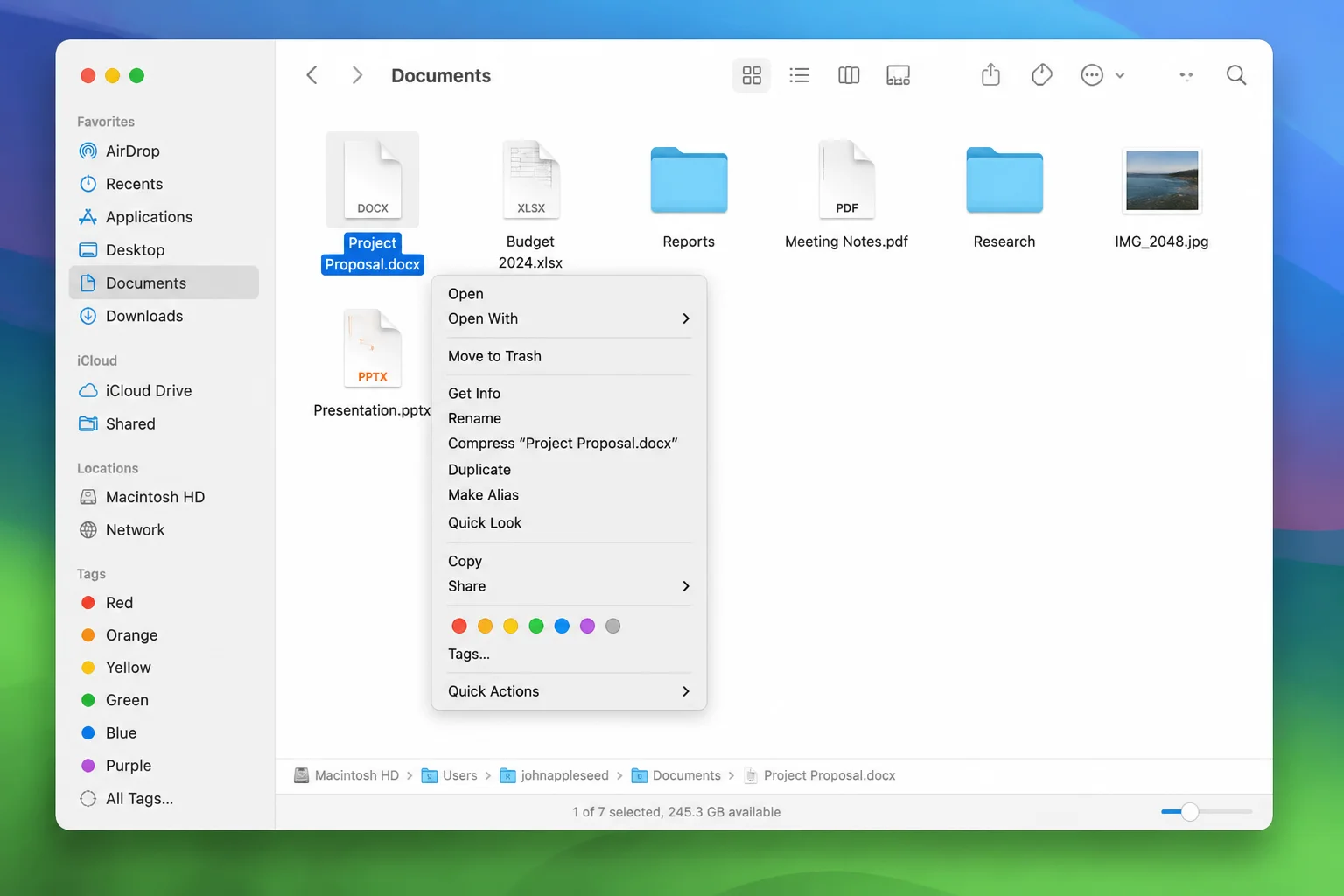 Finder window with a right-click context menu open on a file, triggered by two-finger tap, showing options like Open, Get
