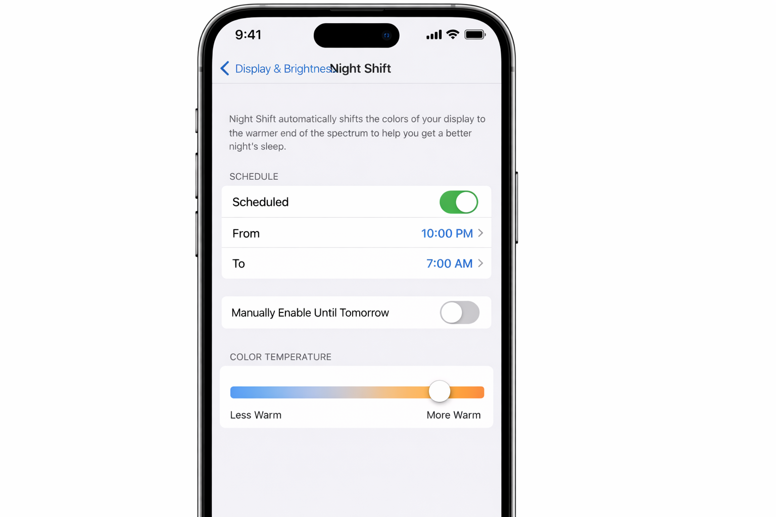 iOS Settings app > Display & Brightness > Night Shift with Scheduled toggle on, bedtime window set, and color temperature slider pushed toward More Warm