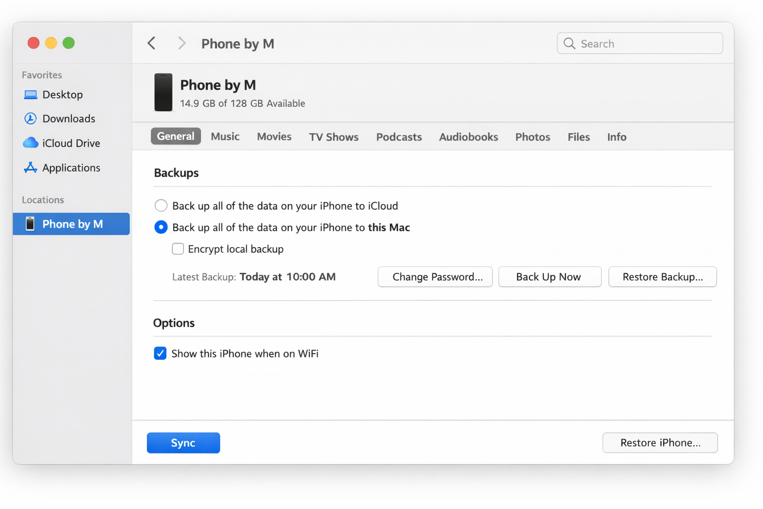Finder with an iPhone selected in the sidebar, showing the General tab with the Backups section set to "Back up all of the data on your iPhone to this Mac" and the "Show this iPhone when on WiFi" checkbox checked under Options