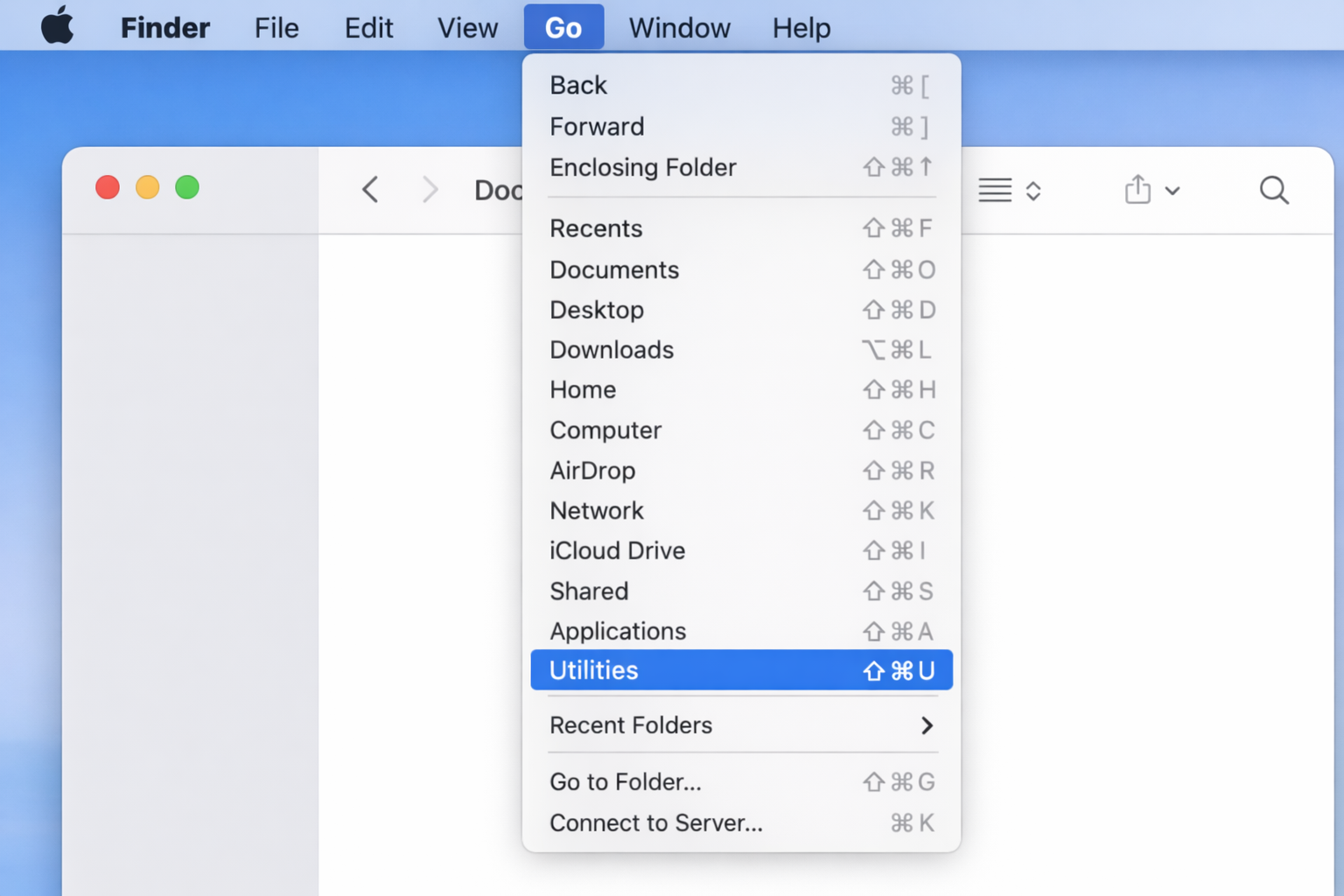 Finder window with Go menu open, Utilities option highlighted in the dropdown