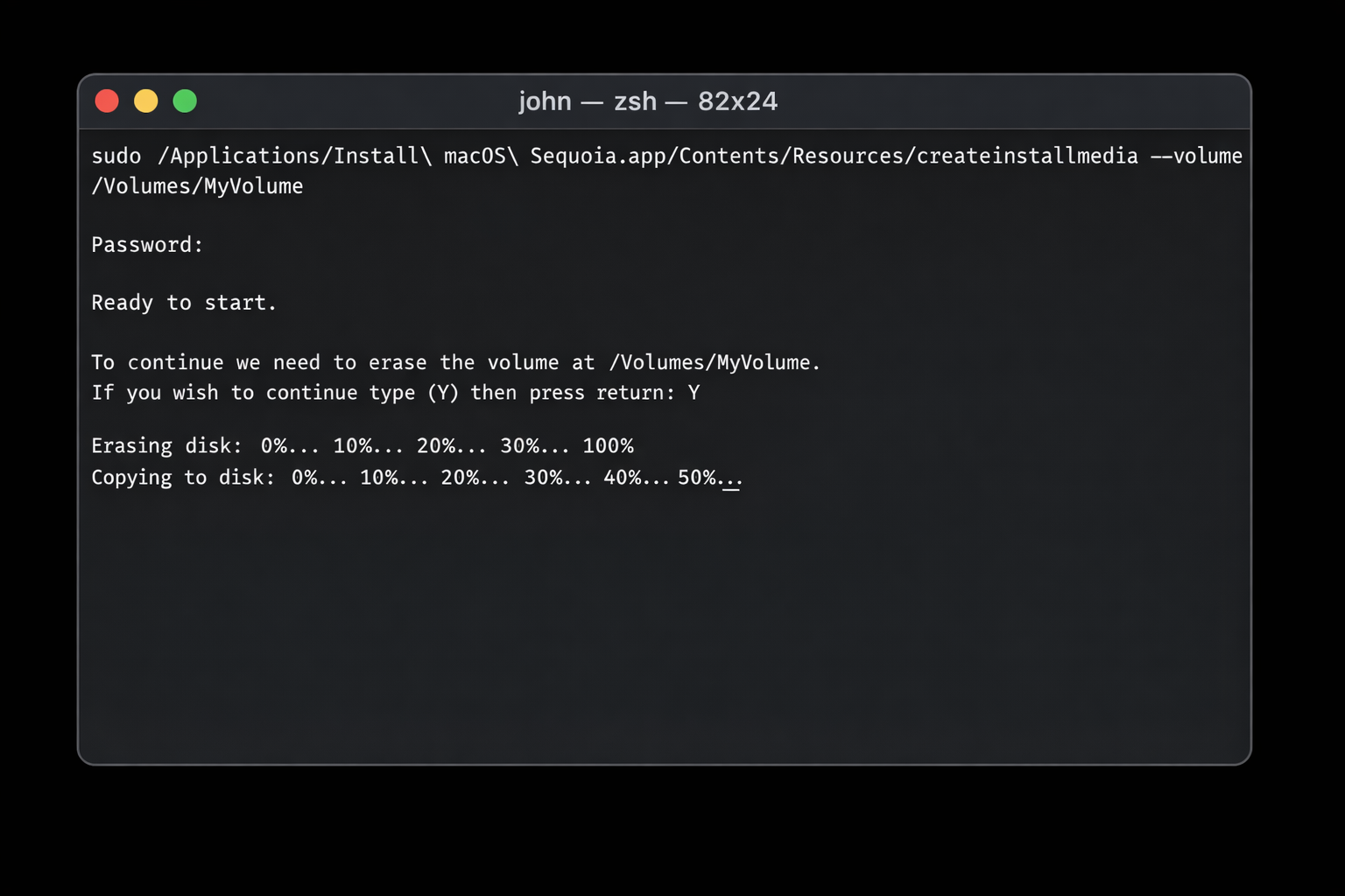 Terminal window showing the createinstallmedia command running with progress output, approximately 50% complete
