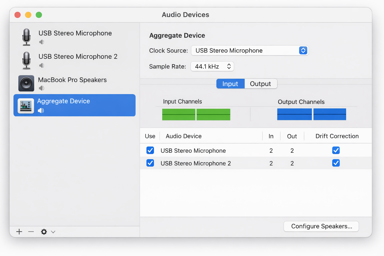 Audio MIDI Setup window showing the Aggregate Device configuration panel with two microphones checked in the device list, clock source dropdown visible