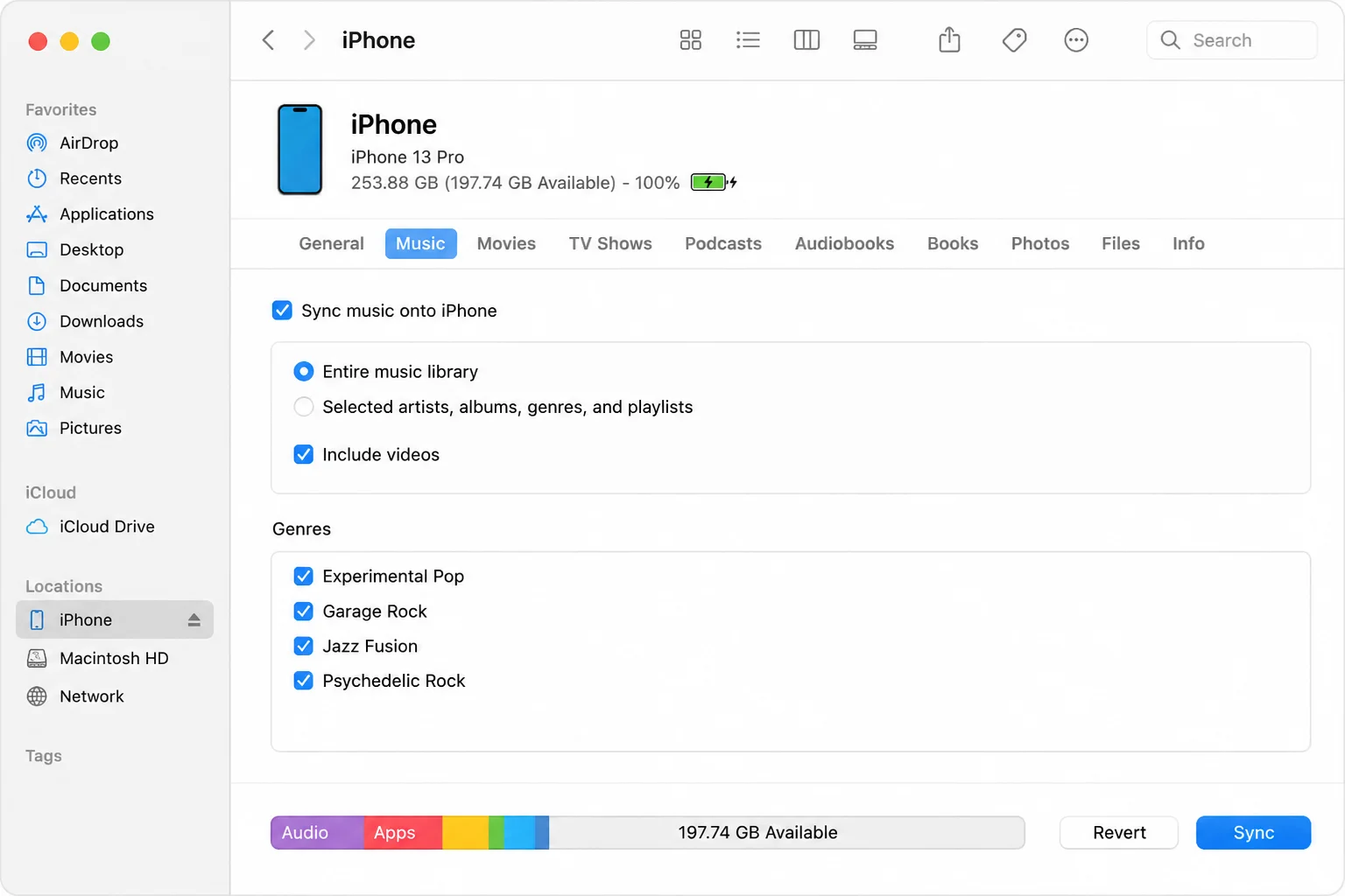 Finder iPhone device page showing the connected phone and completed synchronization status
