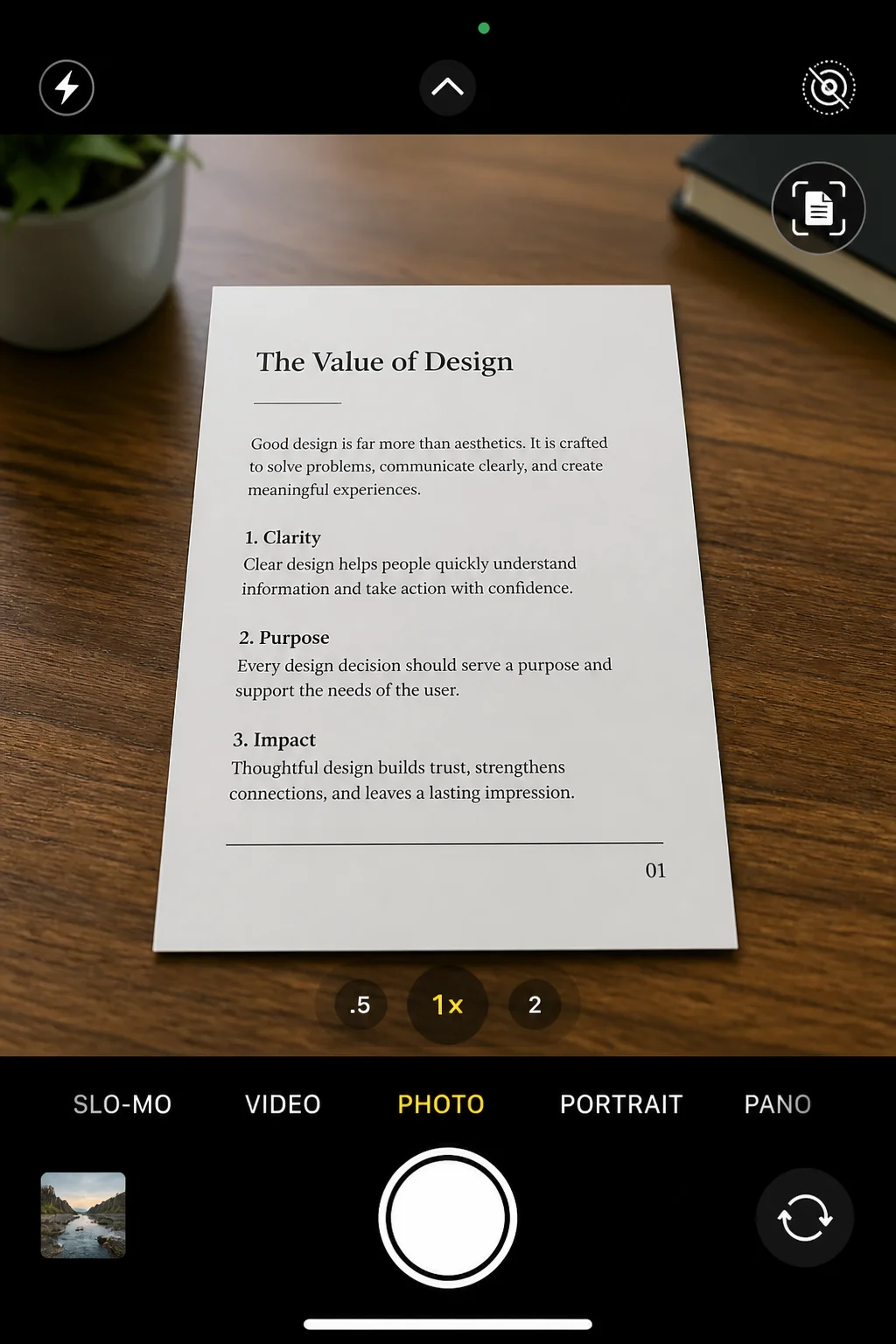 Camera app viewfinder with the small scan-document shortcut icon visible in the corner while pointed at a printed page