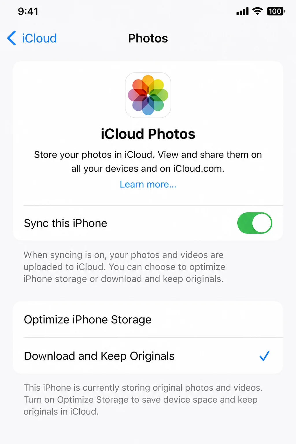 Settings app iCloud Photos screen showing the iCloud Photos toggle enabled and the choice between Optimize iPhone Storage and Download and Keep Originals