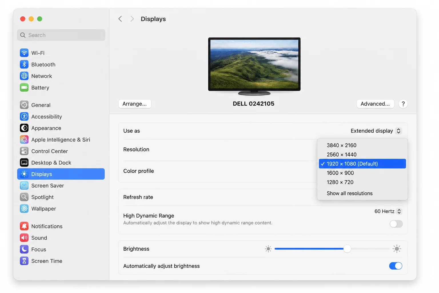 System Settings Displays panel showing the selected external 4K monitor card and current resolution controls